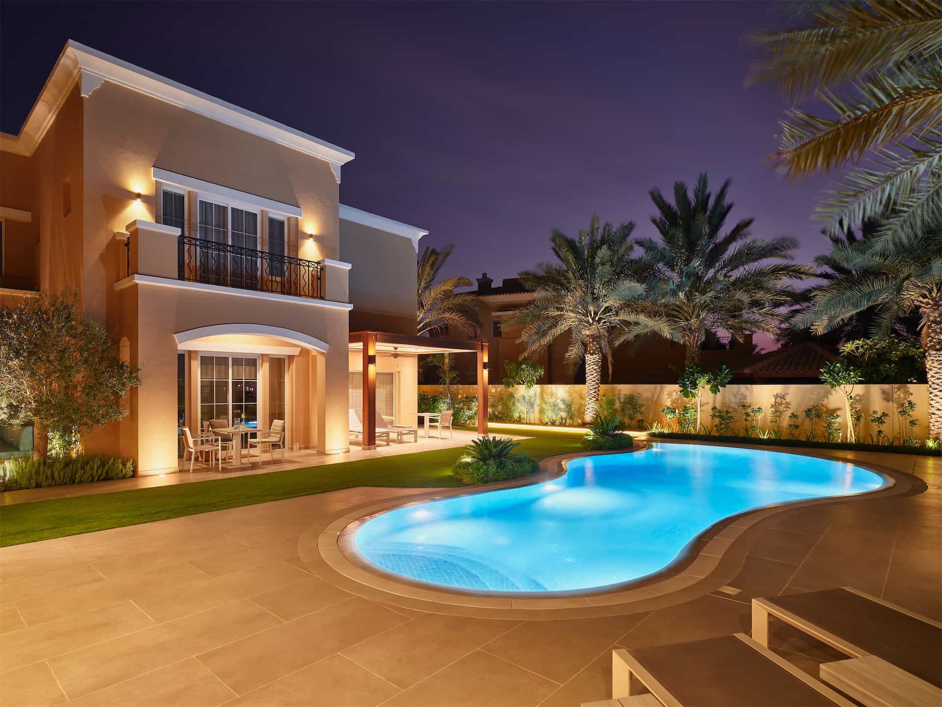 Beautiful villa landscape designed by one of the best landscaping companies in Dubai with a luxury swimming pool and garden